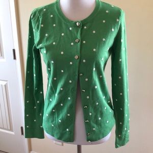 Green cardigan with white polka dots